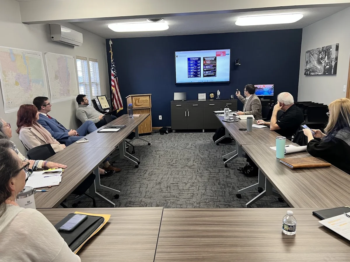 Audience engaged during AI implementation workshop